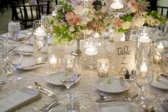 elegant table setting for wedding reception with bouquets